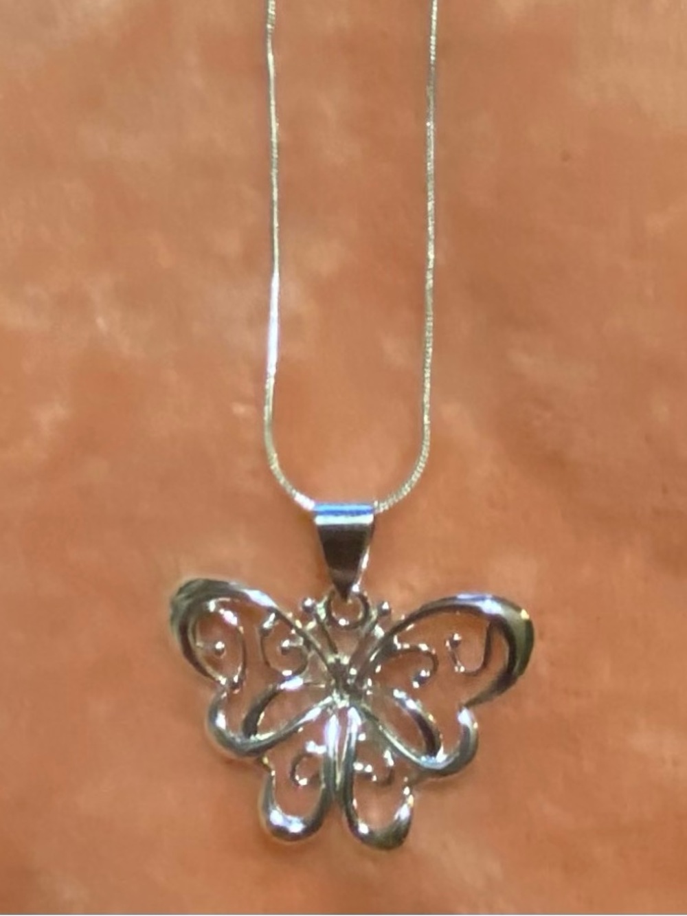 .925 Sterling Silver Butterfly Pendant witj a 17 inch necklace.
